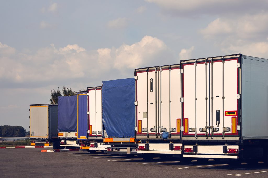 semi-trucks parked in a line
